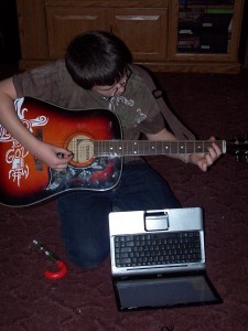 Kid playing guitar
