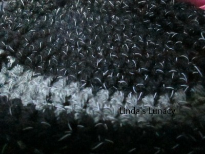 Crochet hat with black reflective yarn