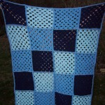 crocheted granny square afghan